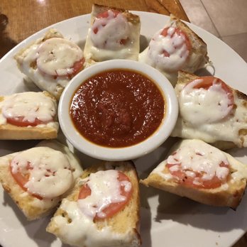 Roma's Italian Restaurant - Homemade garlic bread with tomato and mozzarella cheese and marinara sauce - Italian Near Me - Sanger, Texas Roma's Italian Restaurant - Homemade garlic bread with tomato and mozzarella cheese and marinara sauce - Italian Near Me - Sanger, Texas