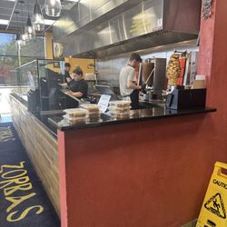 Zorbas Gyros Burgers And More - Working hard to fill the orders!