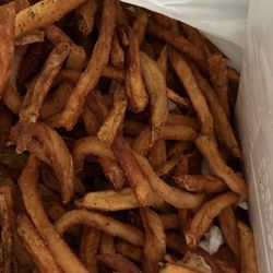 The Dugout Sports Bar & Grill - A ton of limp, soggy ,oil soaked fries I put in the garbage.