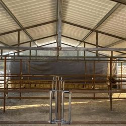 Wilson's Ranch Services - Barn fabrication for a horse barn with telescope designed gates to create bigger or smaller horse pens.