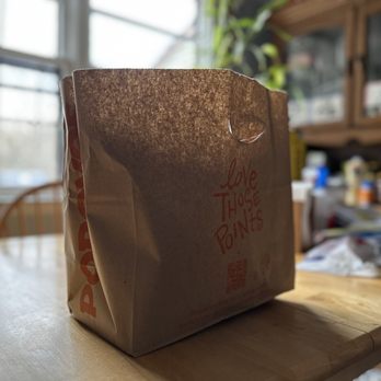 Popeyes Louisiana Kitchen - a paper bag on a table - Fast Food Near Me - Howell, New Jersey Popeyes Louisiana Kitchen - a paper bag on a table - Fast Food Near Me - Howell, New Jersey