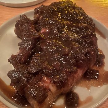Claud - Pork chop with smoked onion jus - Wine Bars Near Me - New York, New York Claud - Pork chop with smoked onion jus - Wine Bars Near Me - New York, New York