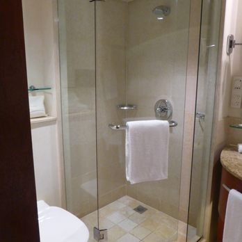 Four Seasons Hotel Sydney - Bathroom with a small shower - Hotels Near Me - Sydney, NSW Four Seasons Hotel Sydney - Bathroom with a small shower - Hotels Near Me - Sydney, NSW