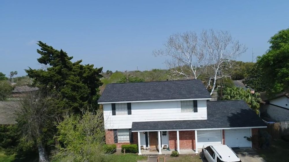 Slide of Vasquez Roofing Company