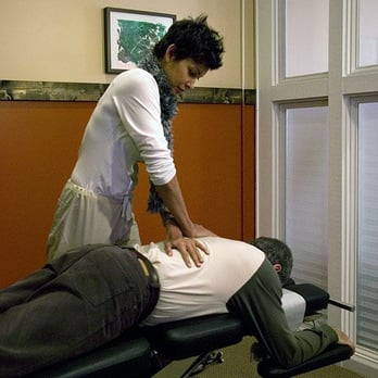 Brain and Body Solutions - Dr. Rimka helping a client through Chiropractic - Chiropractors Near Me - Decatur, Georgia