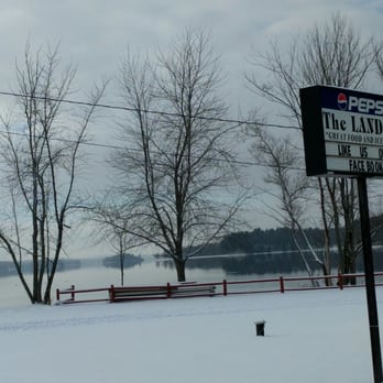 The Landing - a sign for the landing on a snowy day - American Near Me - China, Maine The Landing - a sign for the landing on a snowy day - American Near Me - China, Maine