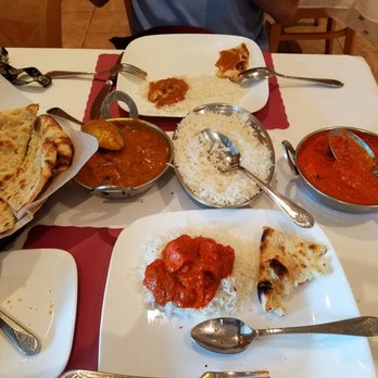Curry & Kabob - Mango Lamb & Chicken Tikki Masala with a side of their Garlic Naan Bread - Indian Near Me - Columbia, Maryland