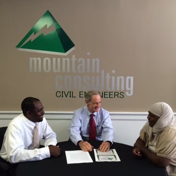 Mountain Consulting - two men sitting at a table - General Contractors Near Me - Dover, Delaware Mountain Consulting - two men sitting at a table - General Contractors Near Me - Dover, Delaware