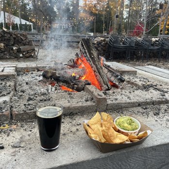 Hop Lot Brewing - Large fire pit. Fire grew. People grew. Very warm. Delicious homemade chips and Guac. Excellent porter. - Breweries Near Me - Suttons Bay, Michigan Hop Lot Brewing - Large fire pit. Fire grew. People grew. Very warm. Delicious homemade chips and Guac. Excellent porter. - Breweries Near Me - Suttons Bay, Michigan
