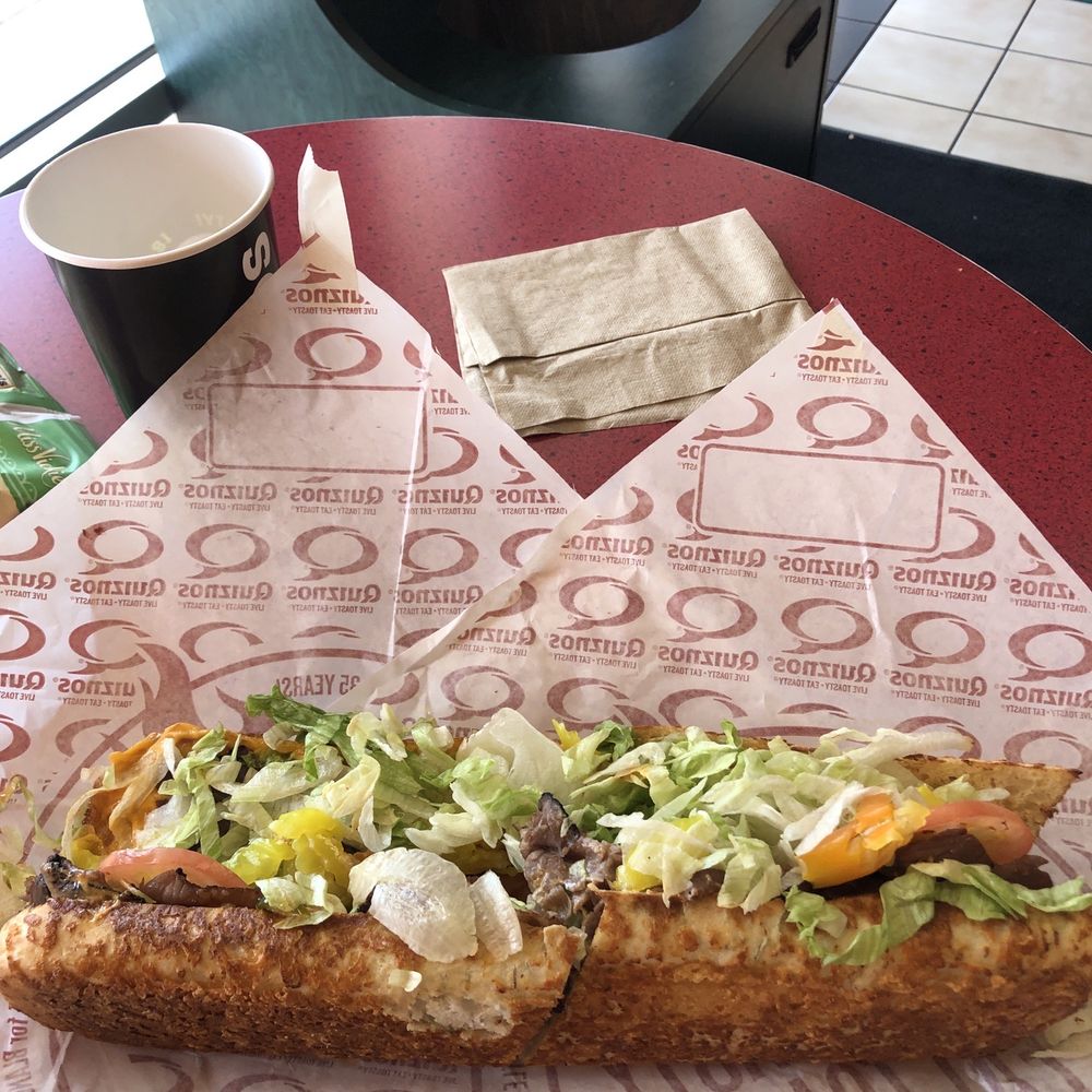 Quiznos - a sub sandwich with lettuce, tomatoes, and onions - Sandwiches Near Me - Round Rock, Texas Quiznos - a sub sandwich with lettuce, tomatoes, and onions - Sandwiches Near Me - Round Rock, Texas