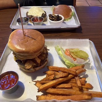 Harbor Cafe - Foreground: BBQ Cowboy burger with sweet potato fries  Background: Shroom and Swiss with sautéed mushrooms - Seafood Near Me - Clarksville, Tennessee