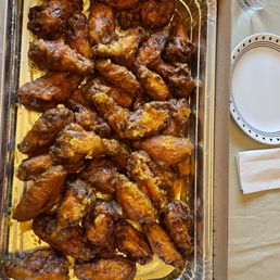 a tray of chicken wings a tray of chicken wings