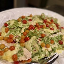 The Malibu Chef - Baked Chicken Breasts tossed in scallion pesto and topped with aby tomato, chopped Havarti and minced onions