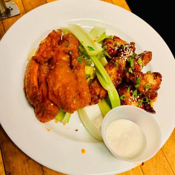 The Pizza Place - a plate of chicken wings and celery - Pizza Near Me - Hampton Bays, New York The Pizza Place - a plate of chicken wings and celery - Pizza Near Me - Hampton Bays, New York