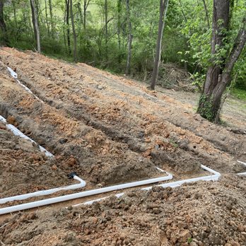 Motivation Septic Services - 10" large diameter pipe drainfield being installed - Septic Services Near Me - Barnardsville, North Carolina