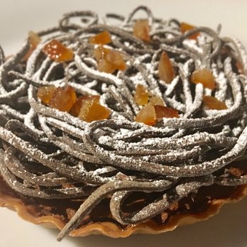 Rossoblu - Chocolate tart: chocolate tart pasta, orange bits, powdered sugar - Italian Near Me - Los Angeles, California Rossoblu - Chocolate tart: chocolate tart pasta, orange bits, powdered sugar - Italian Near Me - Los Angeles, California