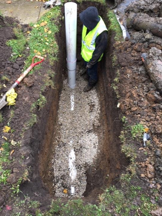 Slide of Suburban Sewer & Septic