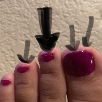 Bombshell Nail & Spa - Polish left on skin.its hard to see uneven application of polish in pic but can on mid big toe.(white parts on big toe are lighting) - Nail Salons Near Me - Las Vegas, Nevada