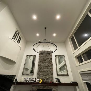 Smart Watt Electric - 18' (feet) high chandelier in a large open living area. - Electricians Near Me Smart Watt Electric - 18' (feet) high chandelier in a large open living area. - Electricians Near Me