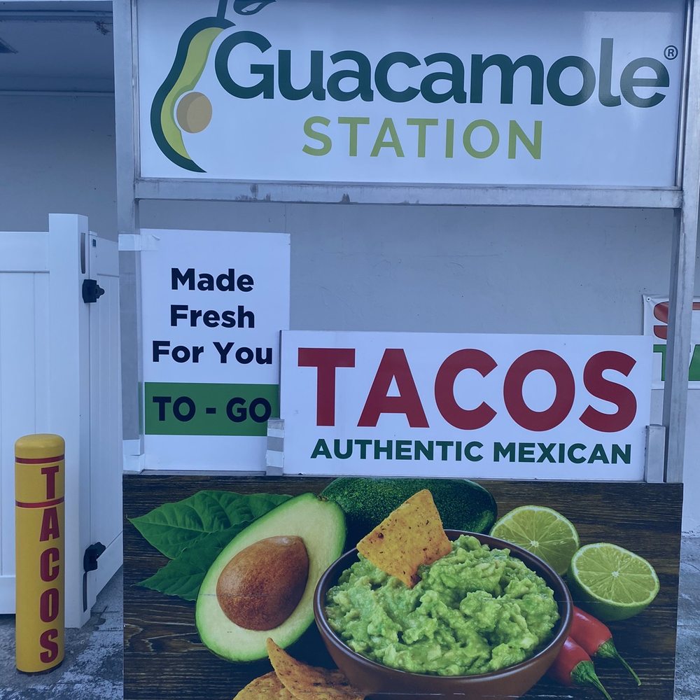 a guacamole station sign a guacamole station sign