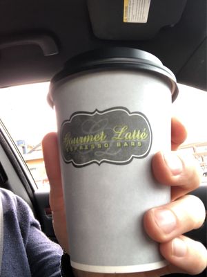 Photo of Gourmet Latté - Seattle, WA, US. a hand holding a coffee cup