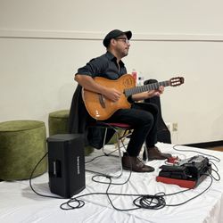 Jose Allende - Jose Allende playing classical guitar during cocktails/ meet and greet at Worcester Free Care Collaborative "Evening of Gratittude" Sept 7