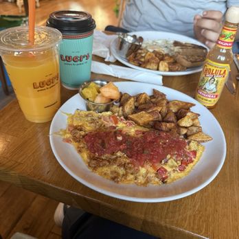 Luci's at the Orchard - Spaniard omelette, fresh pressed OJ, Oat Milk Latte and the boy has the traditional breakfast  yummy! - Breakfast & Brunch Near Me - Phoenix, Arizona