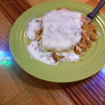Margarita Mexican Gril - a plate of food on a wooden table - Mexican Near Me - Scottsboro, Alabama Margarita Mexican Gril - a plate of food on a wooden table - Mexican Near Me - Scottsboro, Alabama