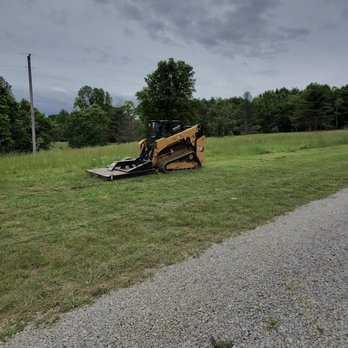 Claiborne Services - CAT 265 compact track loader brush cutting field in Columbia, TN. - Tree Services Near Me Claiborne Services - CAT 265 compact track loader brush cutting field in Columbia, TN. - Tree Services Near Me