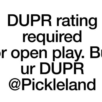 Pickleland - DUPR Required to play - A sign with black text on a white background informs visitors that a DUPR rating is required to participate in open play at Pickleland, a pickleball facility. The sign encourages players to buy their DUPR at Pickleland. - Pickleball Near Me - Pflugerville, Texas