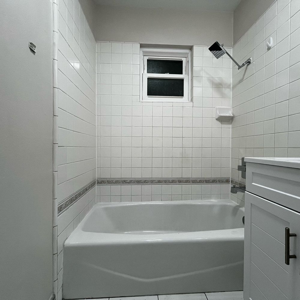 Tixan Construction - New shower trim, includes shower head, tub spout and handle - General Contractors Near Me