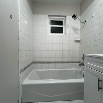 Tixan Construction - New shower trim, includes shower head, tub spout and handle - General Contractors Near Me