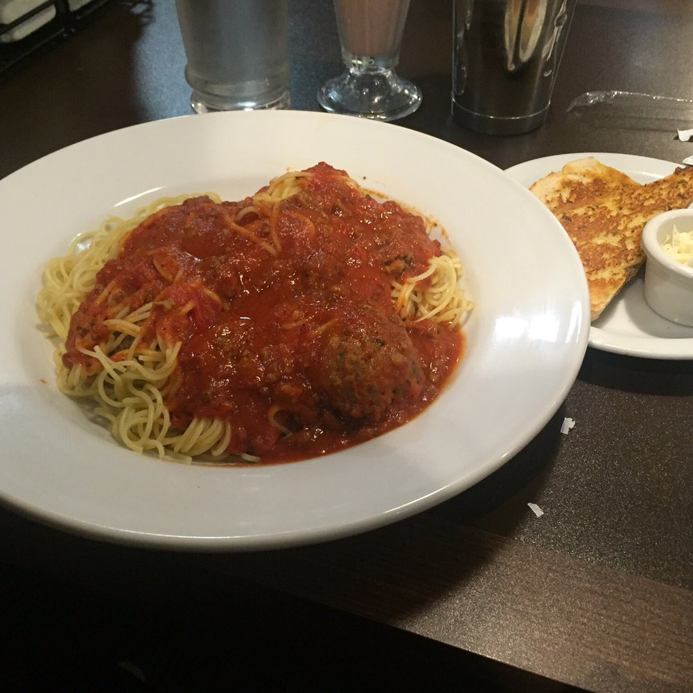 Denny's Restaurant Crossroads - Full plate of spaghetti with three giant meatloaf meatballs and a slice of toasted garlic bread - American Near Me - Calgary, Alberta