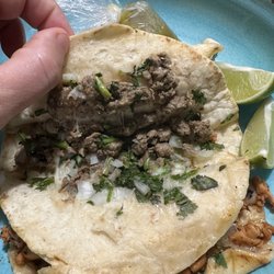 Pacos Bussin Tacos - Carne Asada taco, (Grilled Steak) on flour tortilla with onion, cilantro, cheese and lime.