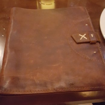 Tiffins Restaurant - Leather-bound menu - definitely gave you an adventurer's vibe! - New American Near Me - Lake Buena Vista, Florida