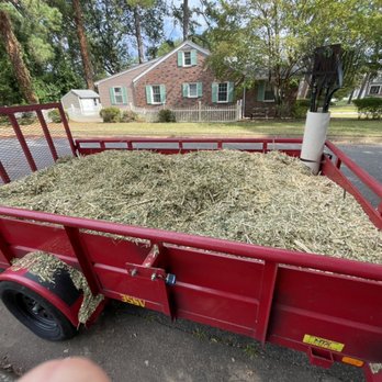 AZHScapes - a red trailer loaded with hay - Landscaping Near Me AZHScapes - a red trailer loaded with hay - Landscaping Near Me