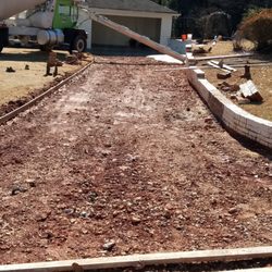 TS Excavation & Concrete Business - Grading and setting up to pour new concrete driveway
