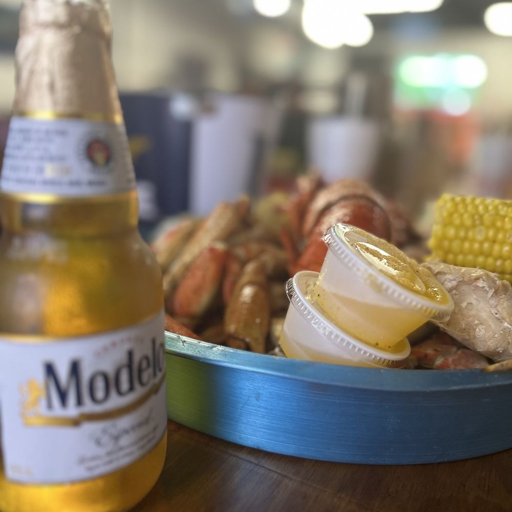 Dewy Dew Bugz - Cold beers and crab legs at the bar - Seafood Near Me - D'Iberville, Mississippi