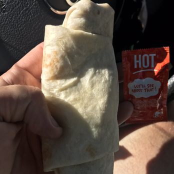 Burger King - a hand holding a burrito - Burgers Near Me - Tooele, Utah Burger King - a hand holding a burrito - Burgers Near Me - Tooele, Utah