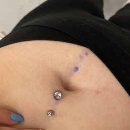 You can see how off centered and crooked the piercing is and it's not even close to my belly button You can see how off centered and crooked the piercing is and it's not even close to my belly button
