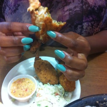 Seafood Shack - Shrimp poppers $7.95.  Seafood mix & a large succulent shrimp with the tail on wrapped in a spicy jalapeño shell, then fried! - Seafood Near Me - Dallas, Texas