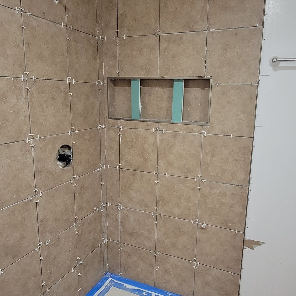 New Beginnings Home Improvement - a shower in a bathroom - Plumbing Near Me New Beginnings Home Improvement - a shower in a bathroom - Plumbing Near Me