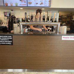 Dunkin' - This is the coolest. A tap style coffee station.