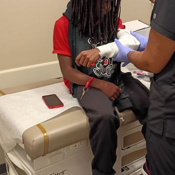 AFC Urgent Care Suffolk - Ms Lisa making Chance feel comfortable about having to get a cast! He positive energy made him feel much better! - Urgent Care Near Me - Suffolk, Virginia