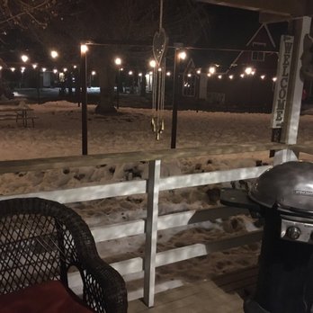 Grey Squirrel Resort & Vacation Rental Homes - Patio overlooking the "hidden creek" covered in snow. - Big Bear Lake, CA