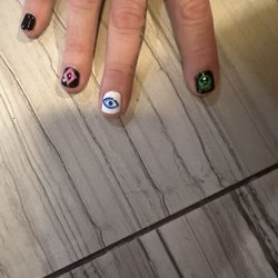 LV Nail & Spa - Linda #1 did a great job with a skull, evil eye and an LV diamond