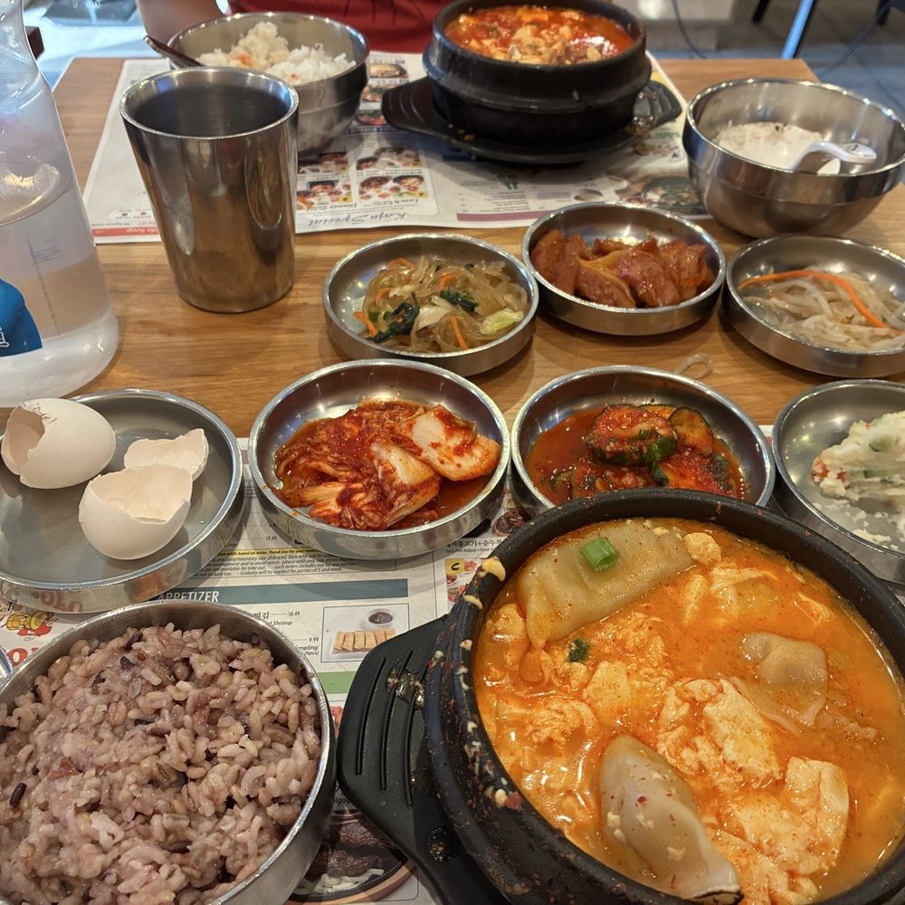Kaju Soft Tofu Restaurant - KIMCHI Tofu Soup with Pork and Beef Dumpling Soft Tofu Soup with brown rice and side dishes - Korean Near Me - Irvine, California Kaju Soft Tofu Restaurant - KIMCHI Tofu Soup with Pork and Beef Dumpling Soft Tofu Soup with brown rice and side dishes - Korean Near Me - Irvine, California