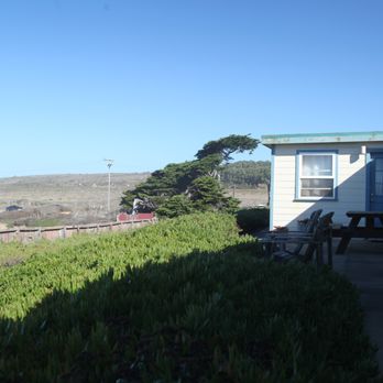 HI-Pigeon Point Lighthouse Hostel - Outside of each room are a couple of chairs and picnic tables. - Hostels Near Me - Pescadero, California