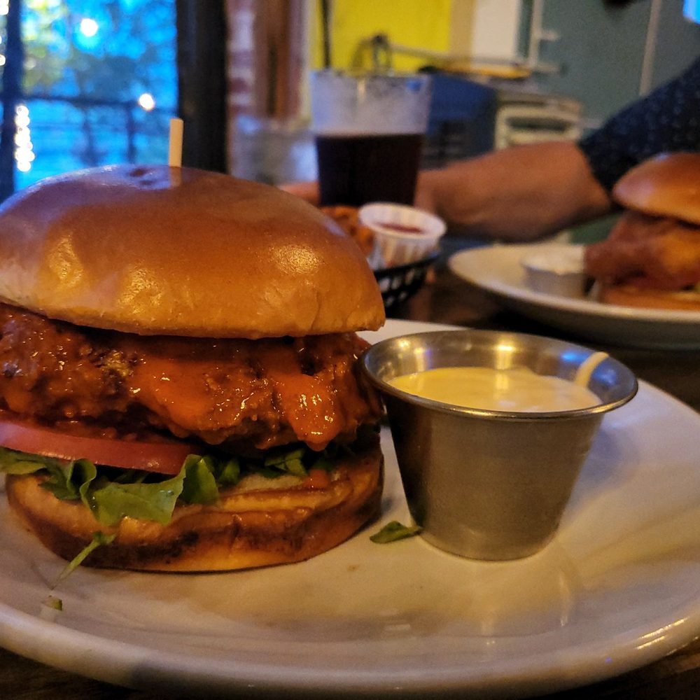 The Kosmos - Loved my Fried Chicken Sandwich minus the mayo, tossed in buffalo with a side of honey mustard. - Bars Near Me - Albuquerque, New Mexico The Kosmos - Loved my Fried Chicken Sandwich minus the mayo, tossed in buffalo with a side of honey mustard. - Bars Near Me - Albuquerque, New Mexico