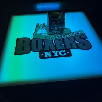 Boxers NYC - Chelsea - a neon table with a neon sign - Gay Bars Near Me - New York, New York